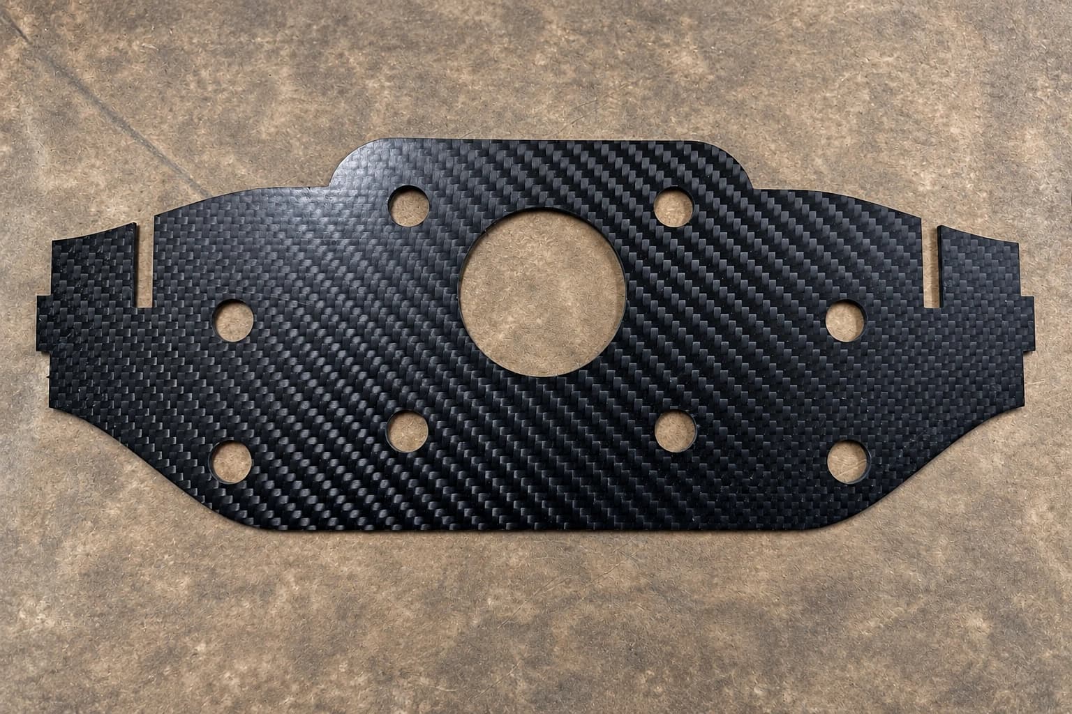 Carbon composite component with machined cutouts